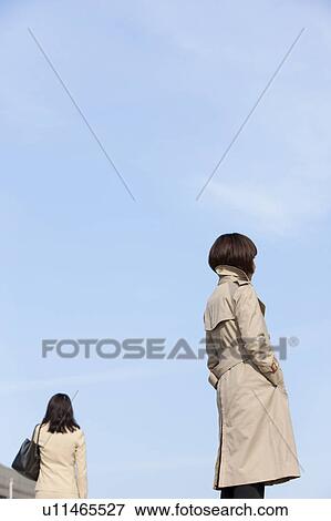 Two businesswomen standing outdoors View Large Photo Image Stock Photo - Two businesswomen standing outdoors. Fotosearch