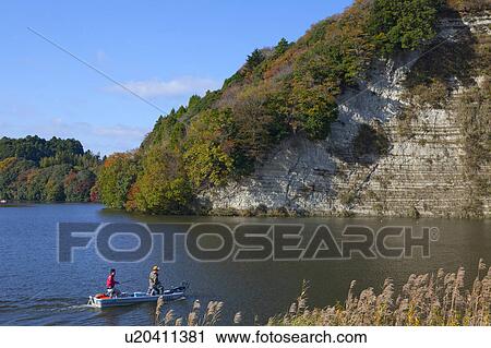 Two Men in Motorboat at Kameyama Lake View Large Photo Image Stock Image - Two Men in Motorboat at Kameyama Lake. Fotosearch