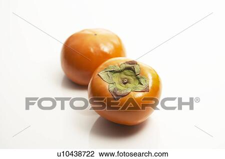 Stock Image - Two persimmons. Fotosearch