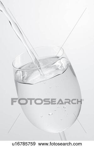 Water being poured into wineglass View Large Photo Image Stock Photo - Water being poured into wineglass. Fotosearch