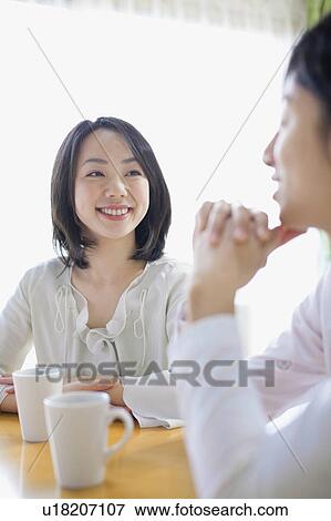 Young Couple Chatting Over Cup of Coffee View Large Photo Image Stock Photo - Young Couple Chatting Over Cup of Coffee. Fotosearch
