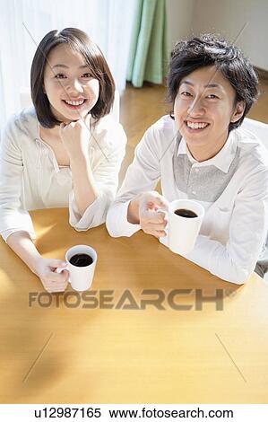 Stock Photography - Young Couple Having Coffee. Fotosearch