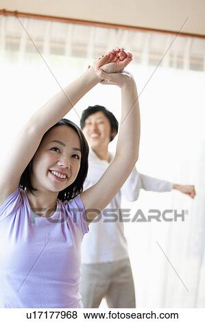 Stock Photo - Young Couple Stretching. Fotosearch