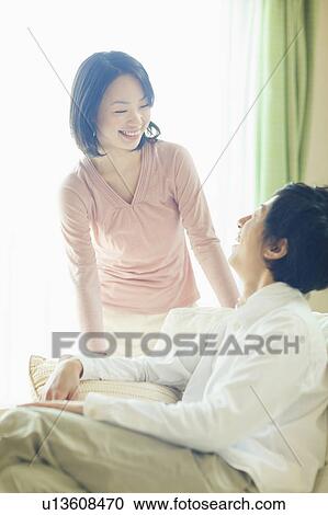 Young Couple Talking to Each Other in Living Room View Large Photo Image Stock Image - Young Couple Talking to Each Other in Living Room. Fotosearch