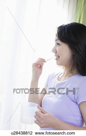 Young Woman Brushing Teeth View Large Photo Image Stock Image - Young Woman Brushing Teeth. Fotosearch
