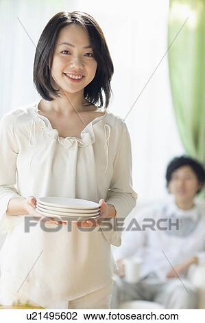 Young Woman Setting The Table View Large Photo Image Stock Image - Young Woman Setting The Table. Fotosearch