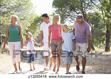 A family, with parents, children and grandparents, walk through park View Large Photo Image Stock Photo - A family, with parents, children and grandparents, walk through park. Fotosearch