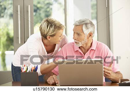 Adult Daughter And Senior Father Using Laptop At Home View Large Photo Image Stock Image - Adult Daughter And Senior Father Using Laptop At Home. Fotosearch