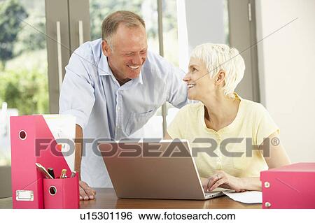 Adult Son And Senior Mother Using Laptop At Home View Large Photo Image Stock Photograph - Adult Son And Senior Mother Using Laptop At Home. Fotosearch