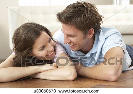 Affectionate Couple Relaxing At Home Together View Large Photo Image Stock Image - Affectionate Couple Relaxing At Home Together. Fotosearch