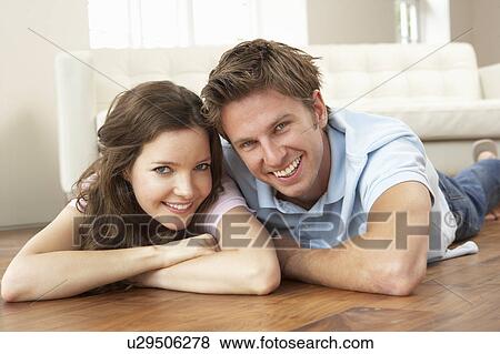 Stock Photo - Affectionate Couple Relaxing At Home Together. Fotosearch
