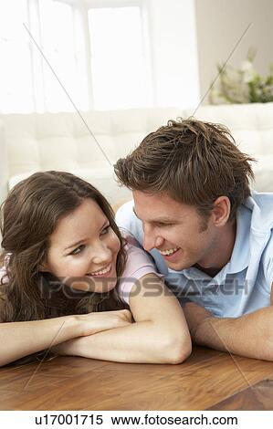Affectionate Couple Relaxing At Home Together View Large Photo Image Stock Photography - Affectionate Couple Relaxing At Home Together. Fotosearch