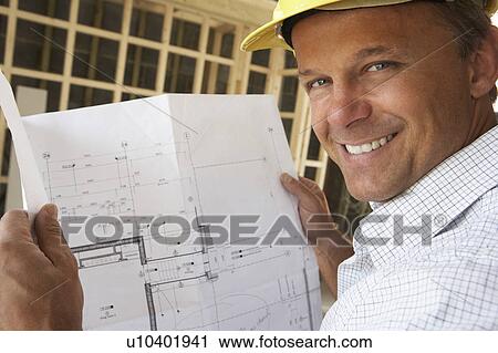 Architect With Plans In New Home View Large Photo Image Stock Image - Architect With Plans In New Home. Fotosearch
