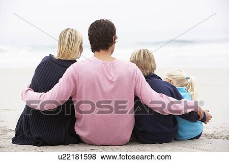 Back View Of Young Family Sitting On Winter Beach View Large Photo Image Stock Photo - Back View Of Young Family Sitting On Winter Beach. Fotosearch