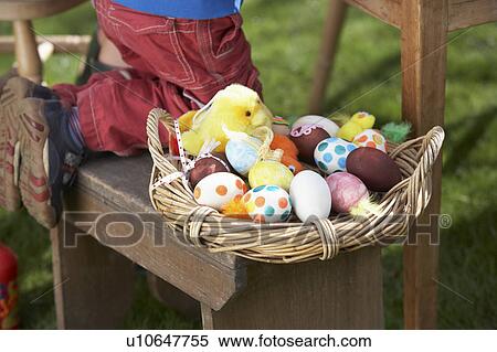 Stock Photography - Basket Of Decorated Easter Eggs In basket. Fotosearch