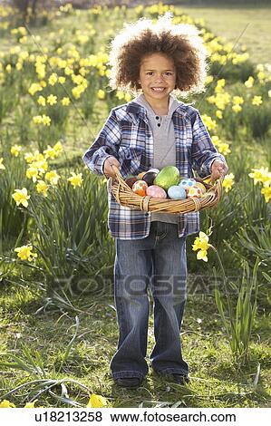 Boy On Easter Egg Hunt In Daffodil Field View Large Photo Image Stock Photo - Boy On Easter Egg Hunt In Daffodil Field. Fotosearch