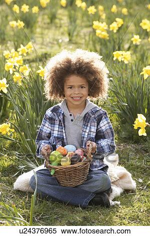 Boy On Easter Egg Hunt In Daffodil Field View Large Photo Image Stock Photography - Boy On Easter Egg Hunt In Daffodil Field. Fotosearch