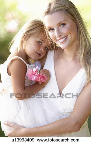 Stock Photo - Bride With Bridesmaids Outdoors At Wedding. Fotosearch