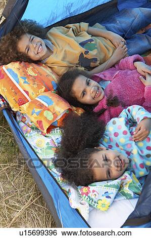 Stock Photograph - Children Having Fun Inside Tent On Camping Holiday. Fotosearch