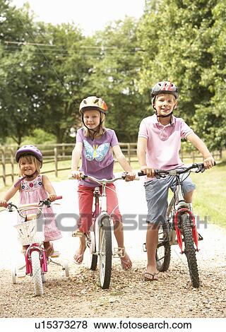 Children In Countryside Wearing Safety Helmets View Large Photo Image Stock Photo - Children In Countryside Wearing Safety Helmets. Fotosearch