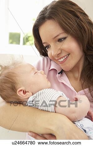 Close Up Of Affectionate Mother Cuddling Baby Boy At Home View Large Photo Image Stock Image - Close Up Of Affectionate Mother Cuddling Baby Boy At Home. Fotosearch