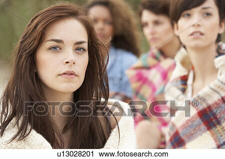 Close Up Of Group Of Girls Sitting On Beach Together View Large Photo Image Stock Image - Close Up Of Group Of Girls Sitting On Beach Together. Fotosearch