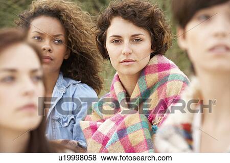 Close Up Of Group Of Girls Sitting On Beach Together View Large Photo Image Stock Photo - Close Up Of Group Of Girls Sitting On Beach Together. Fotosearch