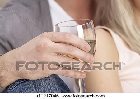 Close Up Of Hand Holding Glass Of White Wine View Large Photo Image Stock Photograph - Close Up Of Hand Holding Glass Of White Wine. Fotosearch