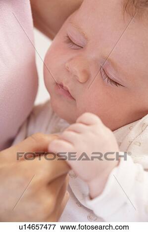 Close Up Of Sleeping Baby Boy Holding Mothers Hand View Large Photo Image Stock Photo - Close Up Of Sleeping Baby Boy Holding Mothers Hand. Fotosearch