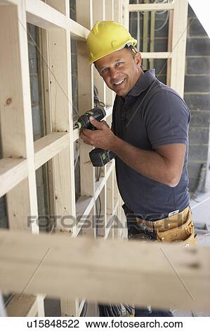 Construction Worker Building Timber Frame In New Home View Large Photo Image Stock Image - Construction Worker Building Timber Frame In New Home. Fotosearch