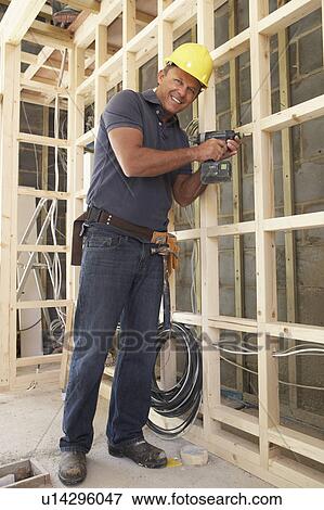 Construction Worker Building Timber Frame In New Home View Large Photo Image Stock Photo - Construction Worker Building Timber Frame In New Home. Fotosearch