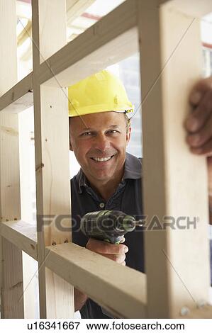 Construction Worker Building Timber Frame In New Home View Large Photo Image Stock Photo - Construction Worker Building Timber Frame In New Home. Fotosearch