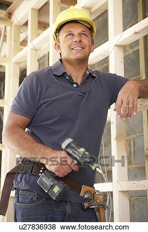 Construction Worker Building Timber Frame In New Home View Large Photo Image Stock Photo - Construction Worker Building Timber Frame In New Home. Fotosearch