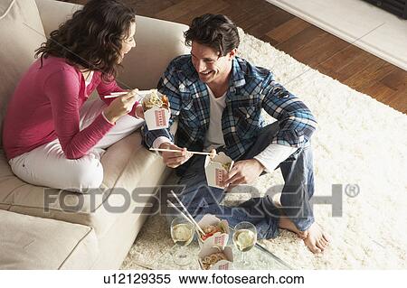Couple Enjoying Chinese Takeaway Meal At Home View Large Photo Image Stock Photography - Couple Enjoying Chinese Takeaway Meal At Home. Fotosearch