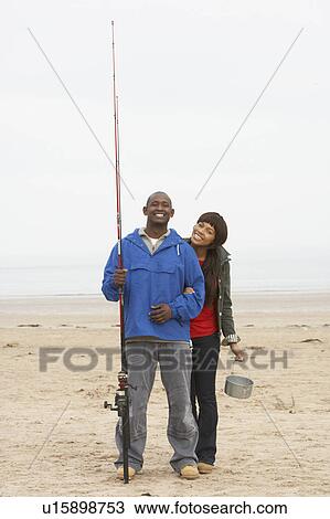 Couple Fishing On Beach View Large Photo Image Stock Image - Couple Fishing On Beach. Fotosearch