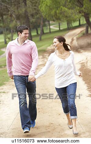 Couple having fun in park View Large Photo Image Stock Image - Couple having fun in park. Fotosearch