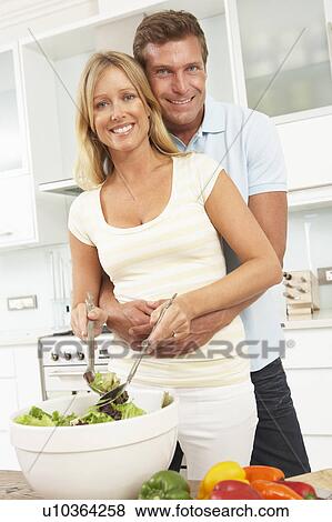 Couple Preparing Salad In Modern Kitchen View Large Photo Image Stock Photo - Couple Preparing Salad In Modern Kitchen. Fotosearch