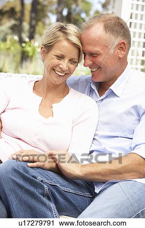 Couple Relaxing In Garden View Large Photo Image Stock Image - Couple Relaxing In Garden. Fotosearch