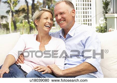 Couple Relaxing In Garden View Large Photo Image Stock Image - Couple Relaxing In Garden. Fotosearch