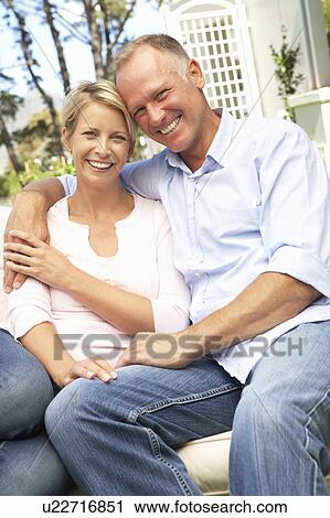 Couple Relaxing In Garden View Large Photo Image Stock Image - Couple Relaxing In Garden. Fotosearch