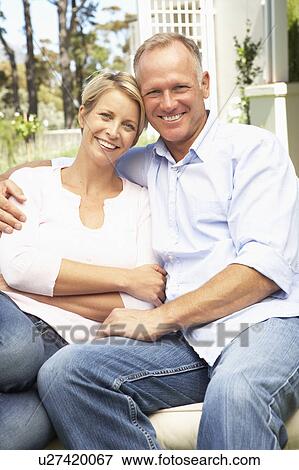 Couple Relaxing In Garden View Large Photo Image Stock Photo - Couple Relaxing In Garden. Fotosearch