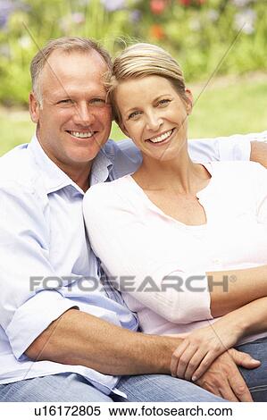 Couple Relaxing In Garden View Large Photo Image Stock Photography - Couple Relaxing In Garden. Fotosearch