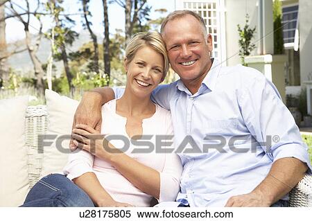 Couple Relaxing In Garden View Large Photo Image Stock Photography - Couple Relaxing In Garden. Fotosearch