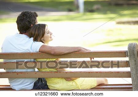 Couple Sitting Together On Park Bench View Large Photo Image Stock Image - Couple Sitting Together On Park Bench. Fotosearch