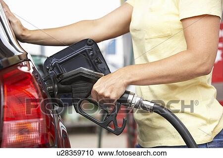 Detail Of Female Motorist Filling Car With Diesel At Petrol Station View Large Photo Image Stock Image - Detail Of Female Motorist Filling Car With Diesel At Petrol Station. Fotosearch