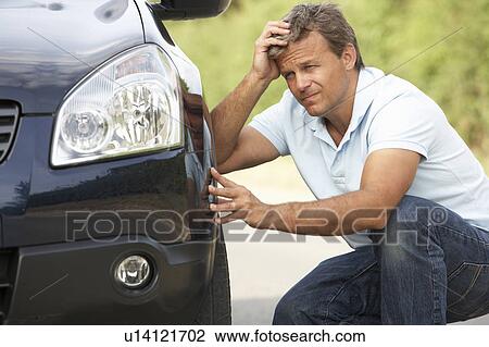 Stock Image - Driver Broken Down On Country Road. Fotosearch