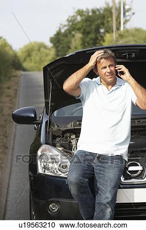 Stock Image - Driver Broken Down On Country Road. Fotosearch