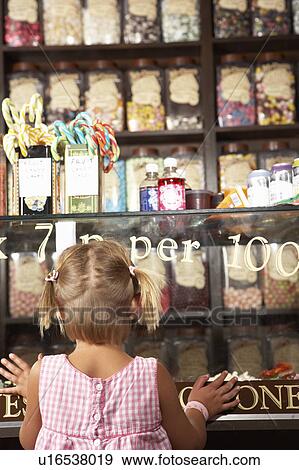 Excited Girl Standing In Sweet Shop View Large Photo Image Stock Photo - Excited Girl Standing In Sweet Shop. Fotosearch