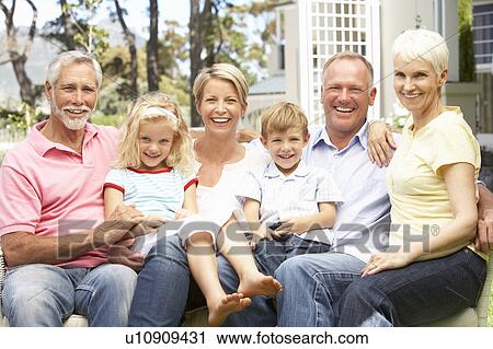 Extended Family Relaxing In Garden View Large Photo Image Stock Image - Extended Family Relaxing In Garden. Fotosearch