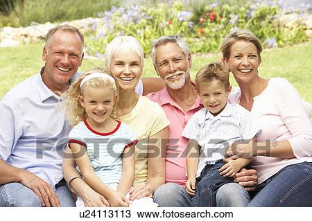 Extended Family Relaxing In Garden View Large Photo Image Stock Image - Extended Family Relaxing In Garden. Fotosearch